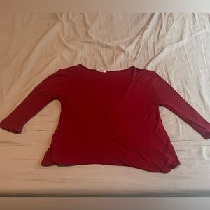 Red quarter sleeve blouse. Low cut front. Size small.